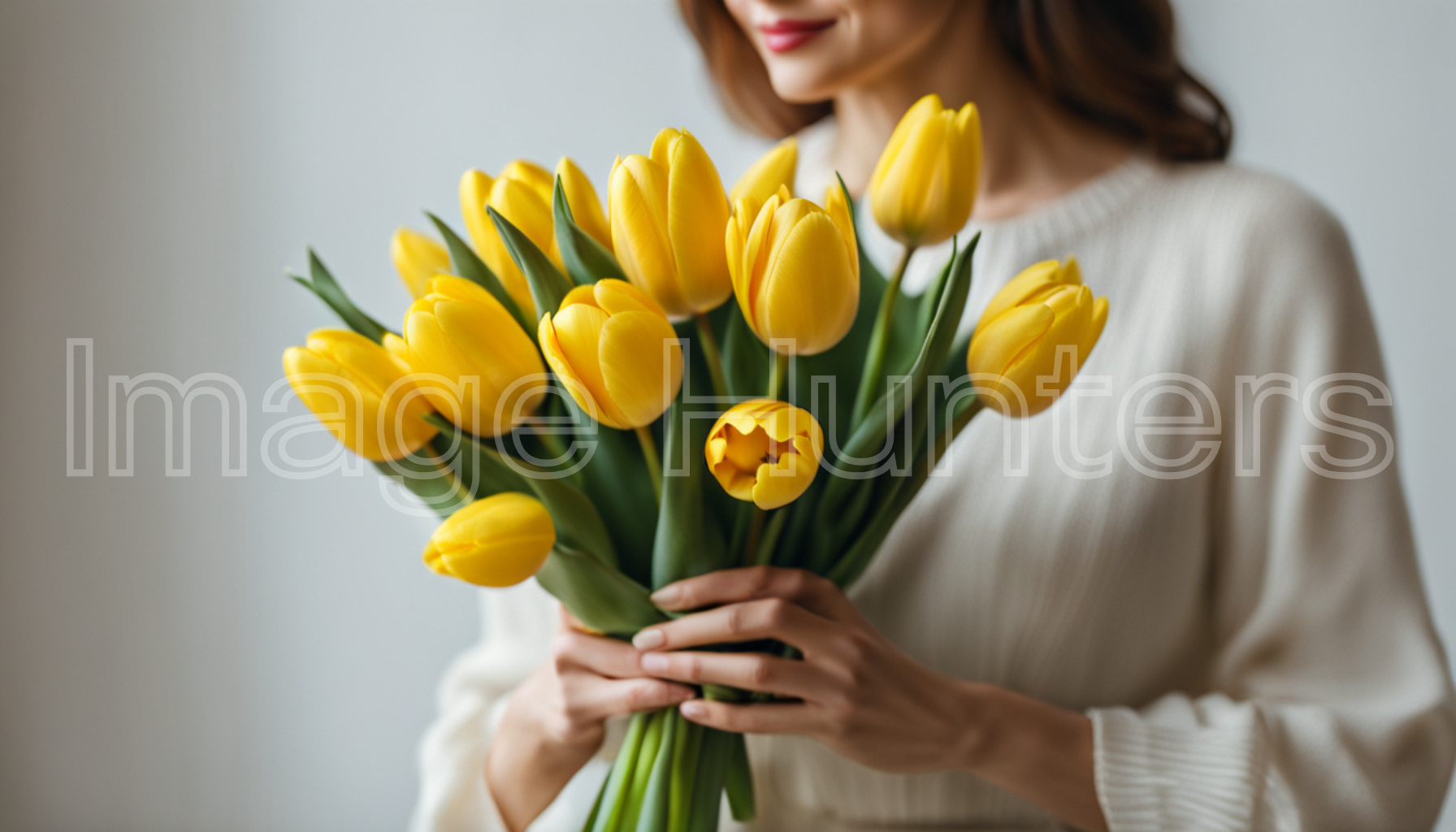 Woman Holding Lovely Yellow Tulip Bouquet