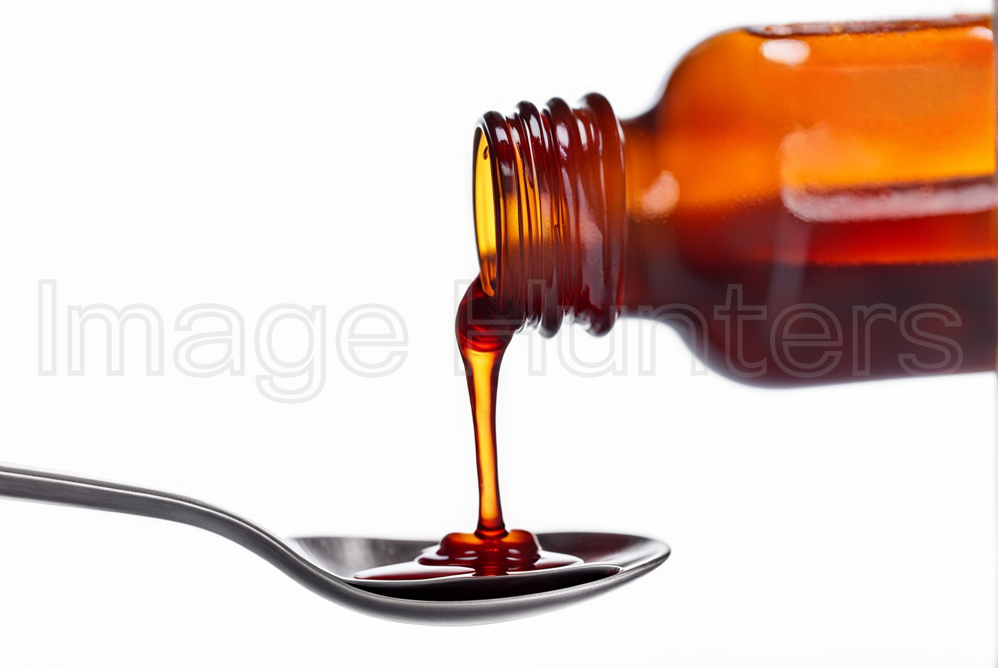 Pouring Cough Medicine into Spoon